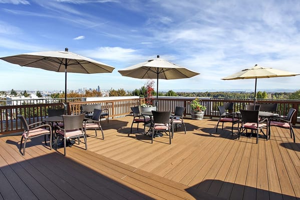 Outdoor patio area with umbrellas and seating