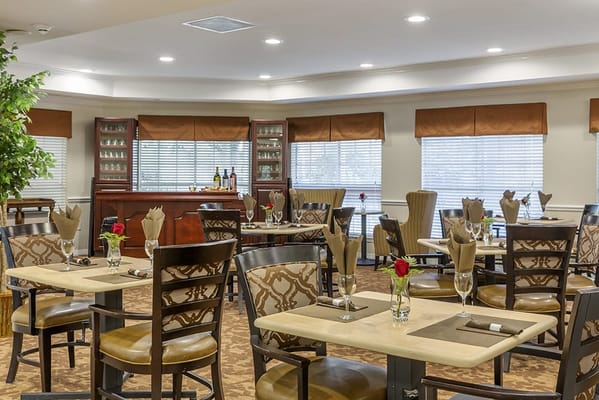 Interior dining area with tables and flowers
