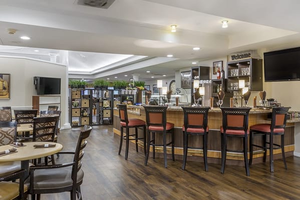 Bright dining area with bar seating and welcoming decor