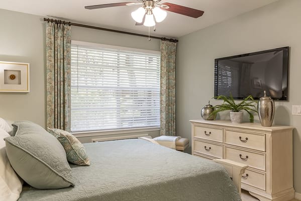 Cozy resident room with a bed and TV