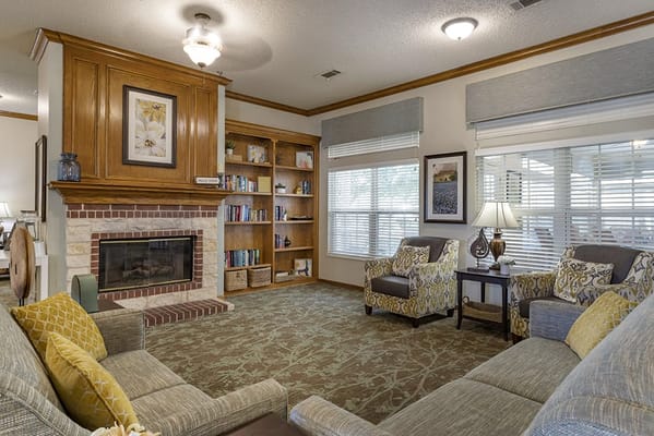 Cozy common area with seating and bookshelves