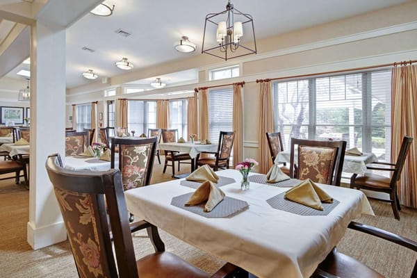Cozy dining area with elegantly set tables