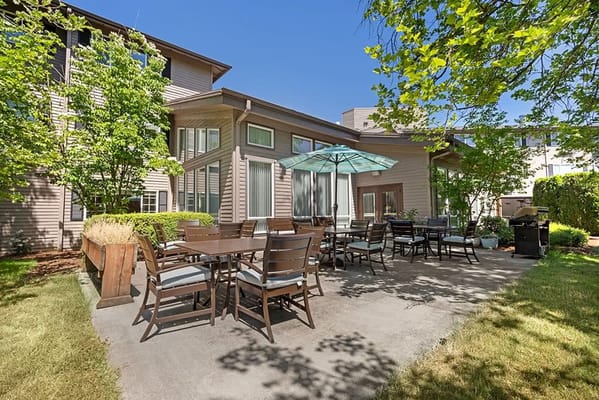 Outdoor patio area with tables and chairs