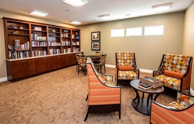 Comfortable living room with bookshelves and seating area
