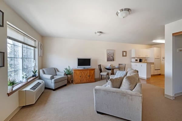 Cozy living area featuring a sofa and dining table