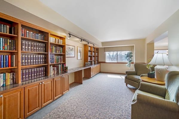 Bright common area with bookshelves and seating