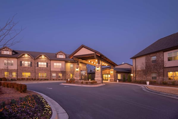 Exterior view of Celebration Village Forsyth at dusk