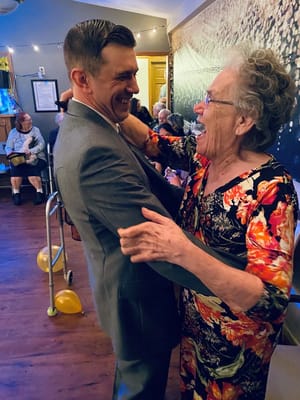 Residents enjoying a dance at a celebration event