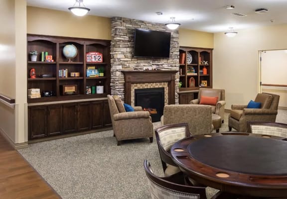 Interior view of a common area with seating and a fireplace