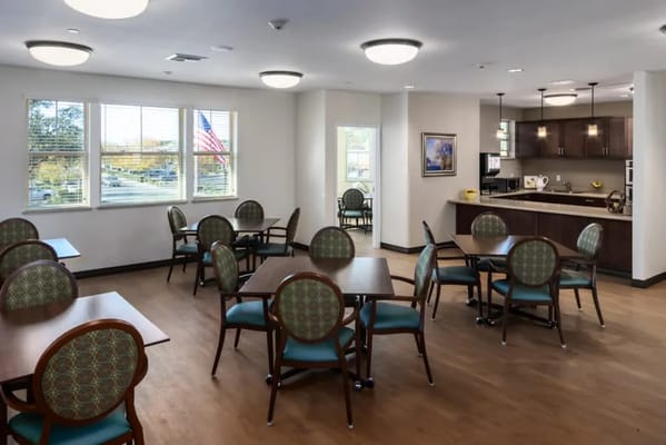 Bright and spacious dining room with tables and chairs