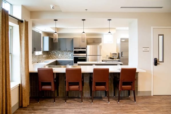 Modern kitchen area with bar seating