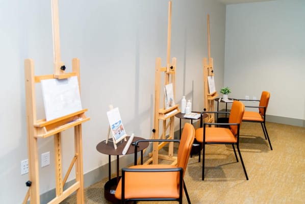 Interior space with easels and chairs set up for activities