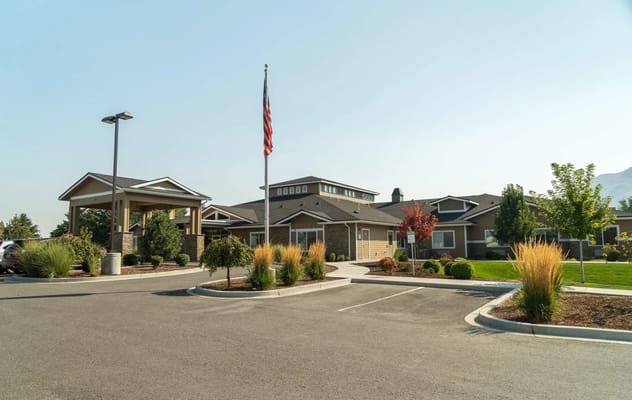 Exterior view of the assisted living facility with landscaped surroundings