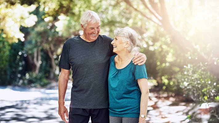 Happy seniors enjoying a walk outdoors