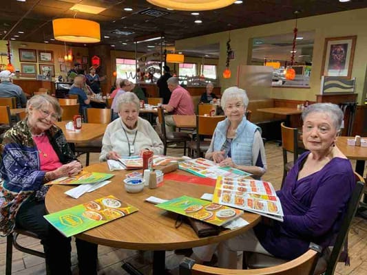Residents enjoying a meal in the dining room.