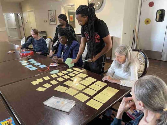 Residents engaged in a group activity at a common area