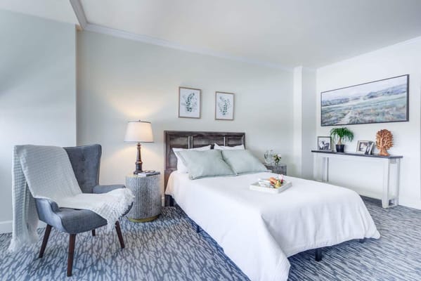 Brightly decorated resident bedroom with a cozy setup