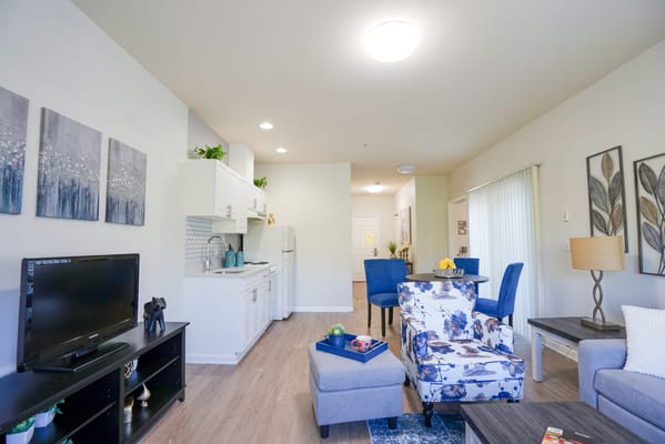 Cozy living room in a resident suite with kitchen