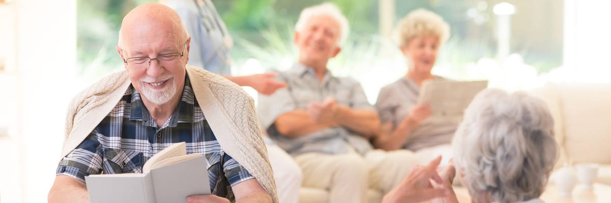 Residents enjoying reading in a common area