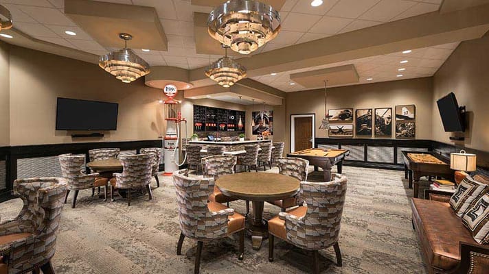 Common area with seating and decor in a senior living facility