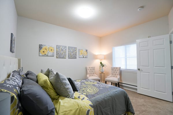 Cozy private room with floral decor and seating area