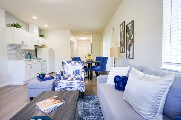 A cozy living room setup in a senior living unit