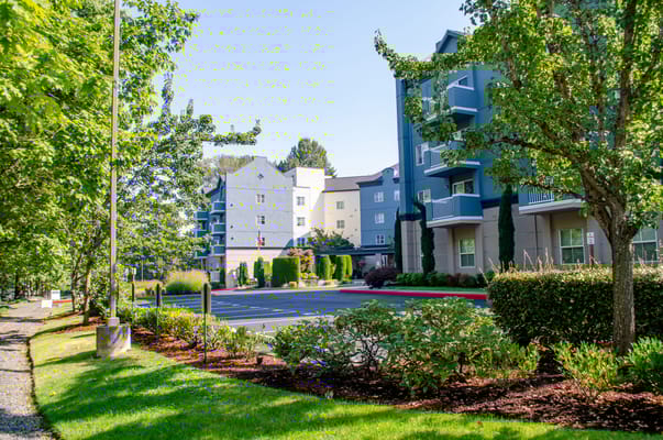 Exterior view of Chateau Valley Center surrounded by greenery