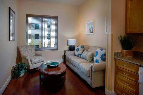 Cozy living space with a sofa and natural light