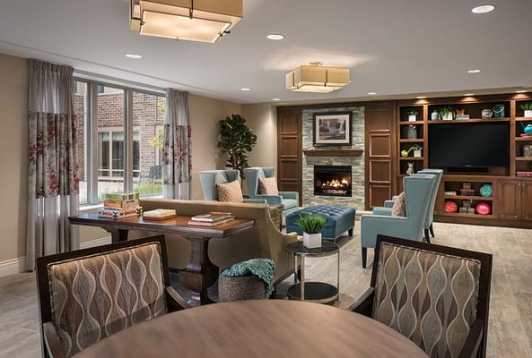 Cozy common area with seating and a fireplace