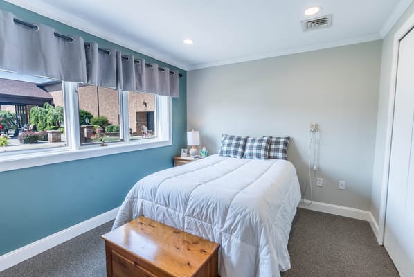 A private room with a bed and light decor