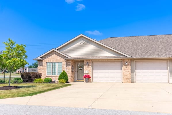 Single-story building exterior with landscaped entrance