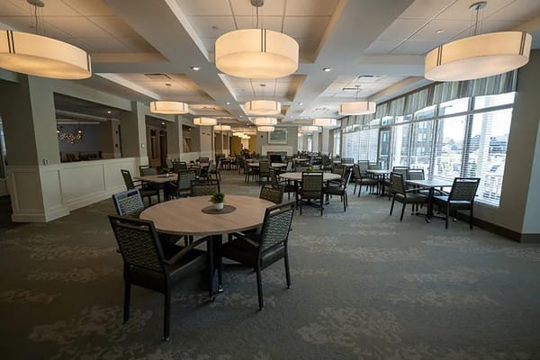 Dining area with tables and overhead lighting