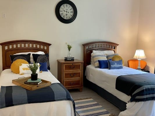 Cozy shared resident bedroom with two beds