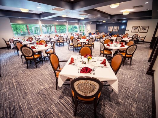 Well-set dining room with elegant tables and chairs