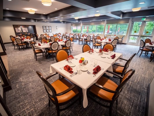 Elegant dining room setup with tables and chairs