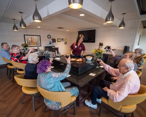 Residents enjoying a celebrations around a dining table