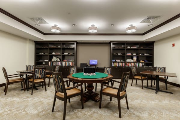 Interior view of a game room with tables and shelves