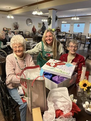 Residents celebrating with a staff member during an event