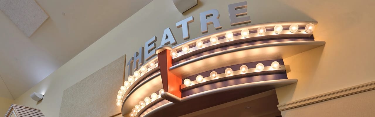 Interior of a theatre with illuminated signage