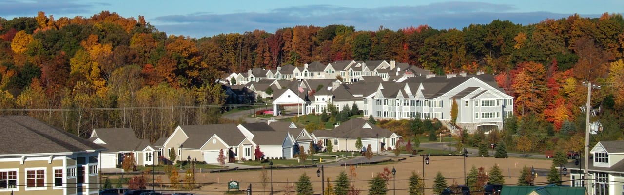 Aerial view of Cook Valley Estates surrounded by autumn foliage