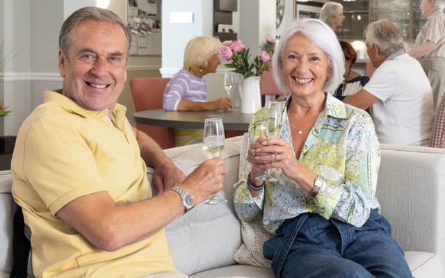 Residents enjoying drinks in a common area