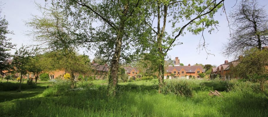 Outdoor view of the retirement property surrounded by trees