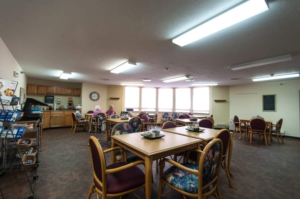 Dining area with residents seated at tables