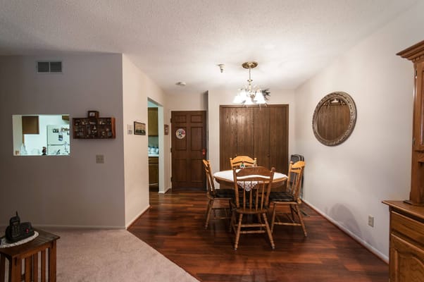 A cozy dining area with a round table and chairs