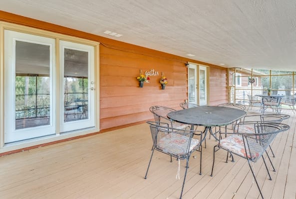 Outdoor patio with seating and flower decor