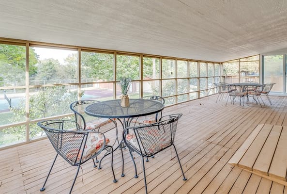 Outdoor seating area with tables and chairs