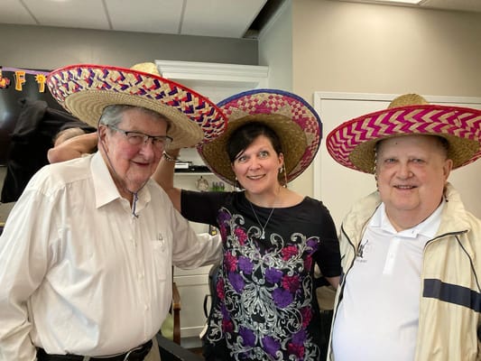 Residents and staff celebrating with sombreros