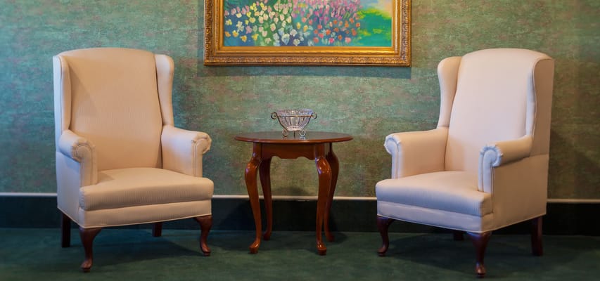 Seating area with two armchairs and a table