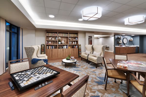 Interior common area with seating and bookshelves