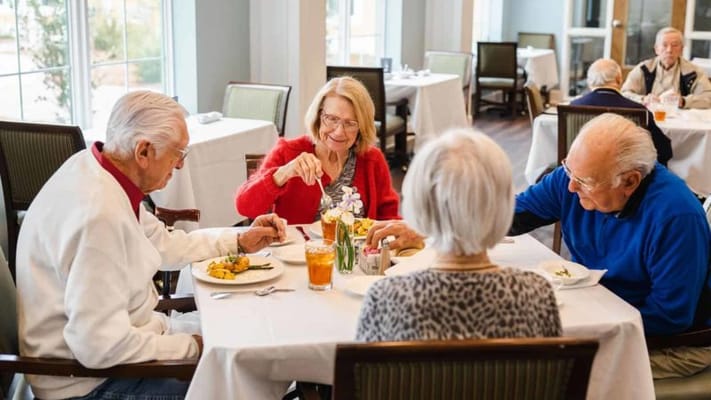 Residents enjoying a meal in the dining room